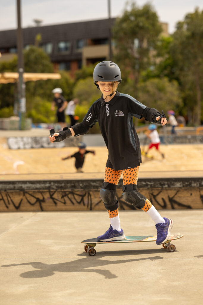 Two children learning to skateboard together with One2Flip in Sydney
